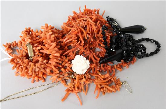 Two coral necklaces, a pair of coral earrings and two other items.